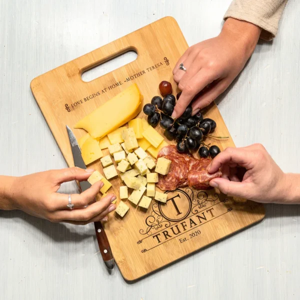 love begins at home cutting board _ Catholic Company